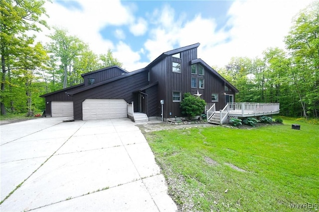 12261 Transit Line Rd, Concord, NY 14141 - view of front facade with an attached garage, concrete driveway, a front yard, a deck, and board and batten siding