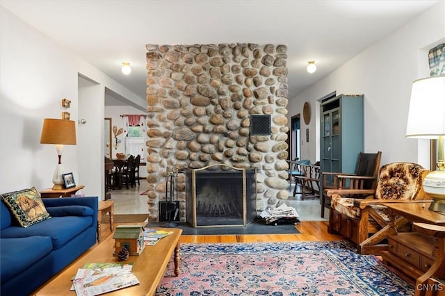 175 S Rondaxe Rd, Webb, NY 13420 - living area with wood finished floors and a fireplace