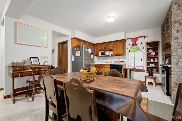 175 S Rondaxe Rd, Webb, NY 13420 - dining area with a wood stove