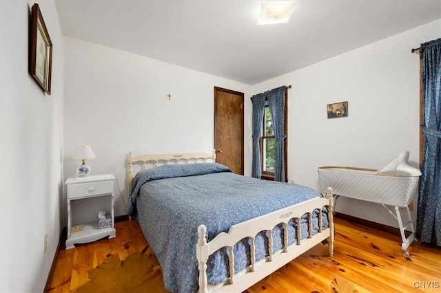 175 S Rondaxe Rd, Webb, NY 13420 - bedroom with wood finished floors and baseboards