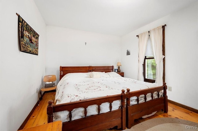175 S Rondaxe Rd, Webb, NY 13420 - bedroom featuring wood finished floors and baseboards