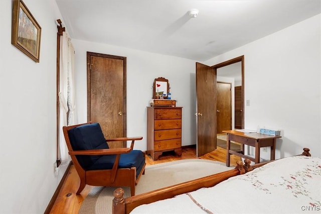 175 S Rondaxe Rd, Webb, NY 13420 - bedroom with wood finished floors and baseboards