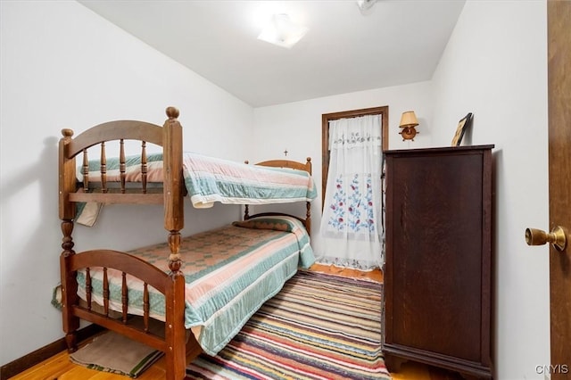 175 S Rondaxe Rd, Webb, NY 13420 - bedroom with wood finished floors and baseboards