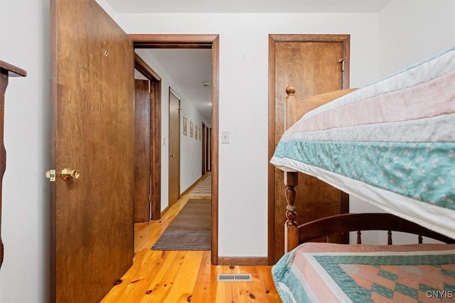 175 S Rondaxe Rd, Webb, NY 13420 - bedroom with wood finished floors