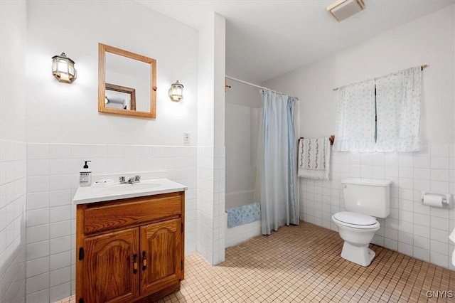 175 S Rondaxe Rd, Webb, NY 13420 - bathroom with tile walls, vanity, tile patterned flooring, shower / tub combo, and wainscoting