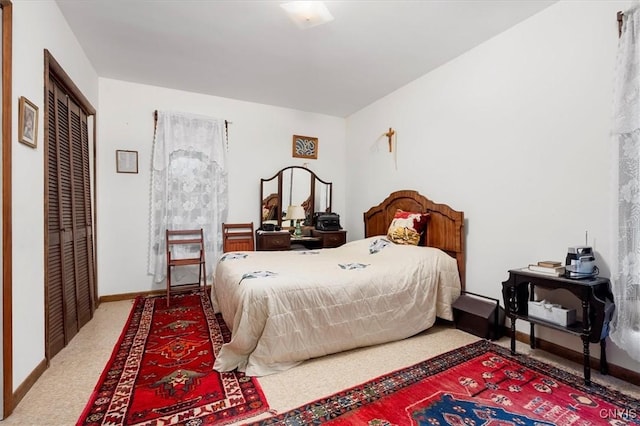 175 S Rondaxe Rd, Webb, NY 13420 - carpeted bedroom featuring baseboards and a closet