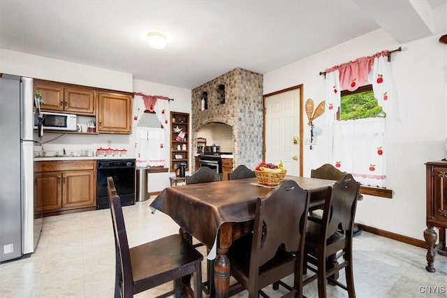 175 S Rondaxe Rd, Webb, NY 13420 - dining area with baseboards