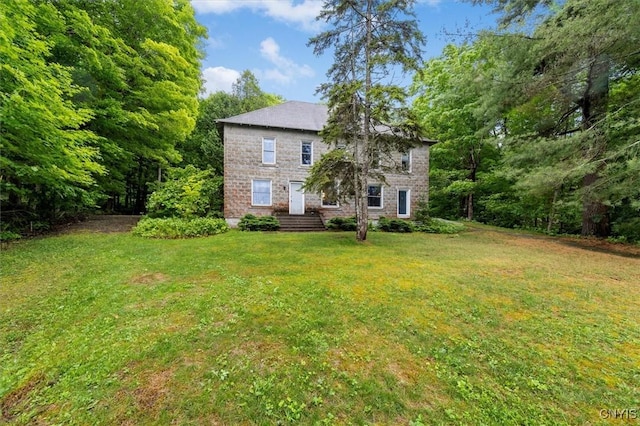 175 S Rondaxe Rd, Webb, NY 13420 - back of property with a yard and stone siding