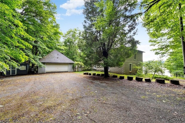 175 S Rondaxe Rd, Webb, NY 13420 - view of property exterior featuring a garage and an outbuilding