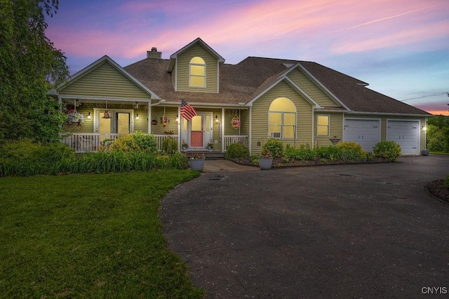 5479 Lake Rd, Tully, NY 13159 - view of front of property featuring driveway, covered porch, a chimney, a front lawn, and roof with shingles