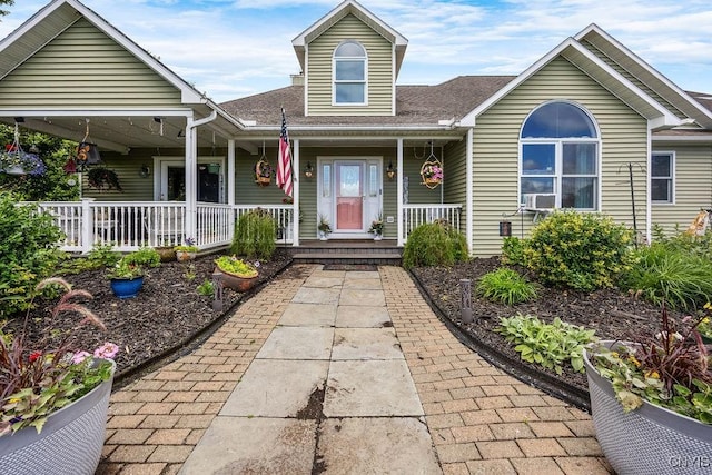 5479 Lake Rd, Tully, NY 13159 - view of front of home with covered porch, roof with shingles, and cooling unit