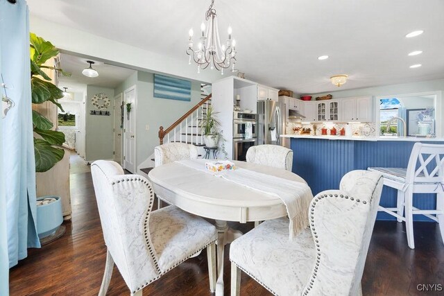 5479 Lake Rd, Tully, NY 13159 - dining area featuring a chandelier, stairs, dark wood-type flooring, and recessed lighting