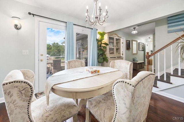 5479 Lake Rd, Tully, NY 13159 - dining space featuring a chandelier, wood finished floors, and stairs