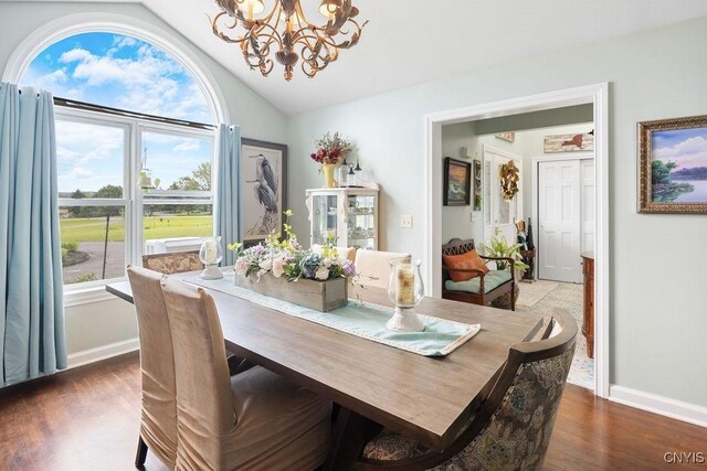 5479 Lake Rd, Tully, NY 13159 - dining space featuring a chandelier, vaulted ceiling, and wood finished floors