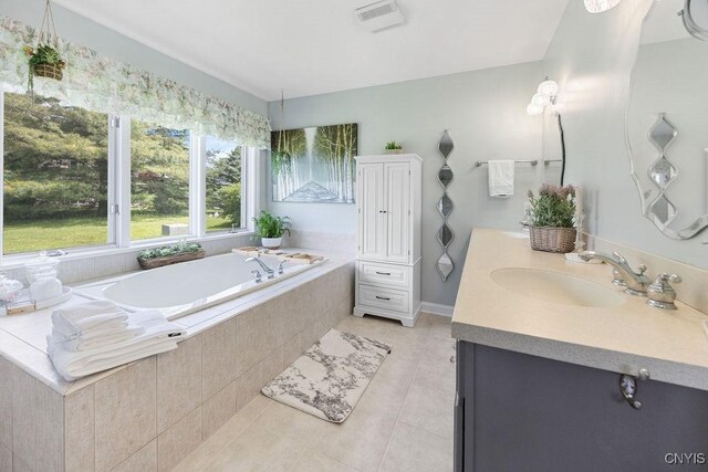 5479 Lake Rd, Tully, NY 13159 - bathroom with tile patterned flooring, vanity, and a garden tub