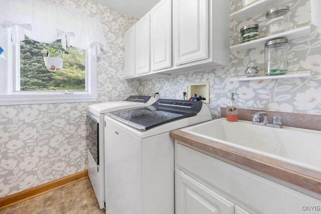 5479 Lake Rd, Tully, NY 13159 - washroom with wallpapered walls, cabinet space, and washing machine and clothes dryer