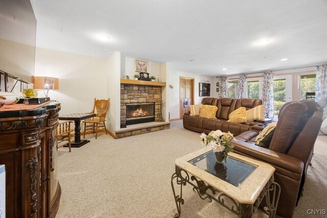 5479 Lake Rd, Tully, NY 13159 - living room featuring carpet floors, a stone fireplace, and recessed lighting