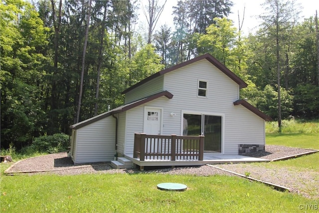 6234 Reservoir Rd, Lebanon, NY 13346 - back of property featuring a lawn, a deck, and a forest view