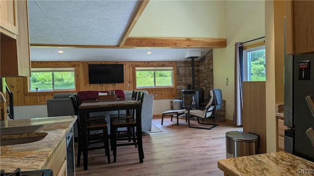 6234 Reservoir Rd, Lebanon, NY 13346 - dining area featuring a wood stove, plenty of natural light, wood finished floors, recessed lighting, and a textured ceiling