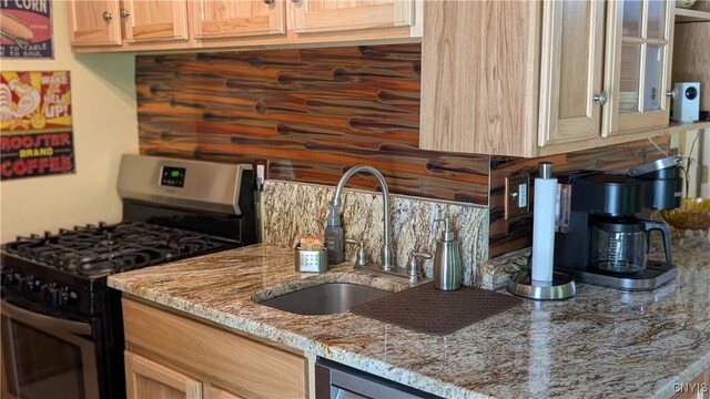 6234 Reservoir Rd, Lebanon, NY 13346 - kitchen featuring stainless steel range with gas cooktop, tasteful backsplash, light stone countertops, and glass insert cabinets