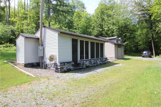 6234 Reservoir Rd, Lebanon, NY 13346 - view of side of home with a yard and stone siding