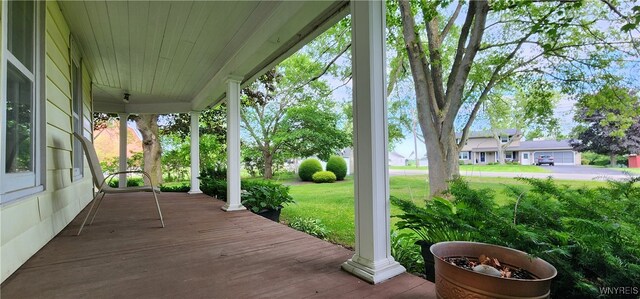 7029 Akron Rd, Lockport Town, NY 14094 - porch featuring a lawn