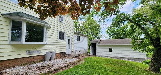 7029 Akron Rd, Lockport Town, NY 14094 - back of house featuring a yard, crawl space, and cooling unit