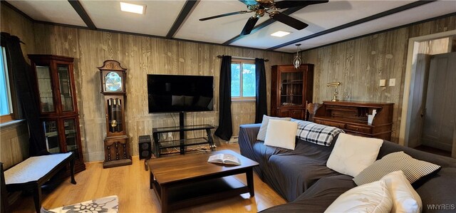 7029 Akron Rd, Lockport Town, NY 14094 - living area with a ceiling fan, light wood-style floors, and wooden walls