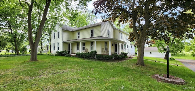 7029 Akron Rd, Lockport Town, NY 14094 - country-style home featuring a front yard and covered porch