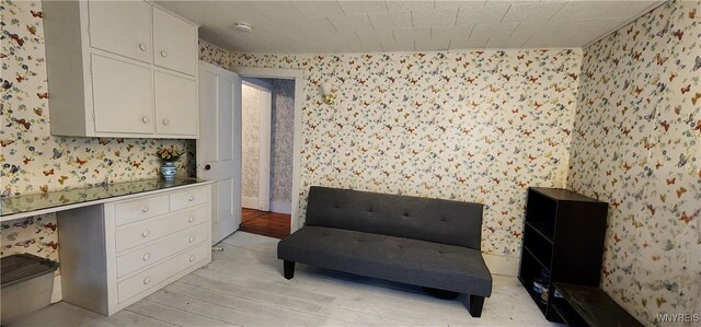 7029 Akron Rd, Lockport Town, NY 14094 - sitting room with wallpapered walls and light wood-type flooring
