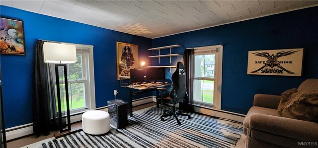 7029 Akron Rd, Lockport Town, NY 14094 - carpeted office featuring an accent wall and a baseboard heating unit