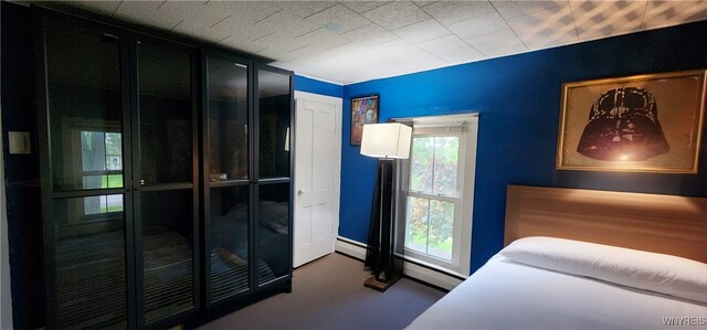 7029 Akron Rd, Lockport Town, NY 14094 - bedroom with carpet flooring and baseboard heating