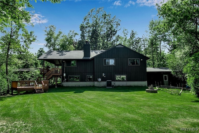 17 Quail, Orchard Park, NY 14127 - rear view of property with stairway, a wooden deck, a chimney, and a lawn
