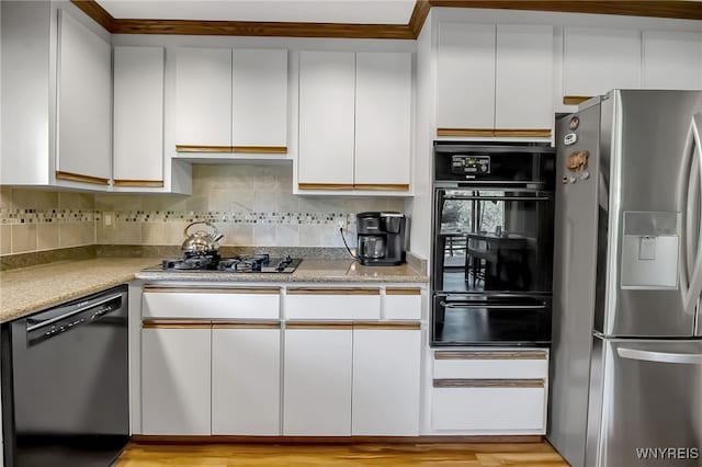 17 Quail, Orchard Park, NY 14127 - kitchen featuring black appliances, a warming drawer, white cabinetry, and light countertops