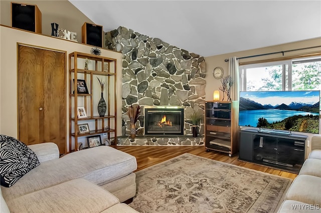 17 Quail, Orchard Park, NY 14127 - living area with lofted ceiling, wood finished floors, and a stone fireplace