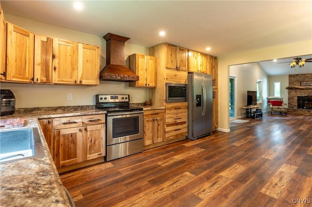 217 Sloperville Rd, Albion, NY 13302 - kitchen with stainless steel appliances, custom exhaust hood, open floor plan, dark wood finished floors, and a fireplace