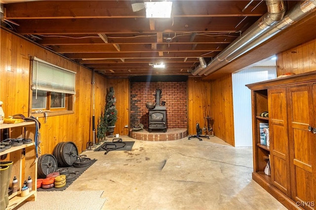 217 Sloperville Rd, Albion, NY 13302 - workout room featuring a wood stove and wood walls