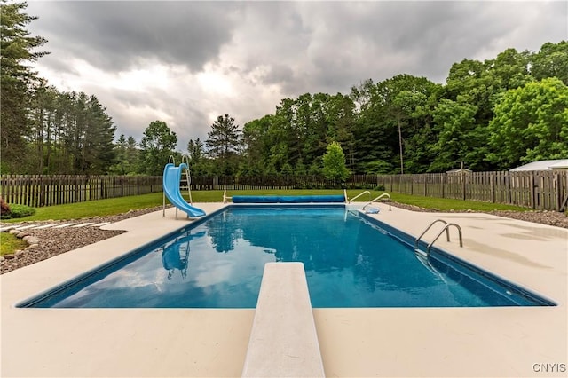 217 Sloperville Rd, Albion, NY 13302 - view of pool featuring a water slide, a fenced backyard, a patio area, and a diving board