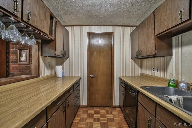 664 Upper Mountain Rd, Lewiston, NY 14092 - kitchen featuring dishwasher, a textured ceiling, light countertops, and wooden walls