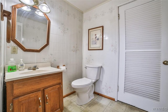 664 Upper Mountain Rd, Lewiston, NY 14092 - bathroom featuring vanity, tile walls, tile patterned floors, and ornamental molding