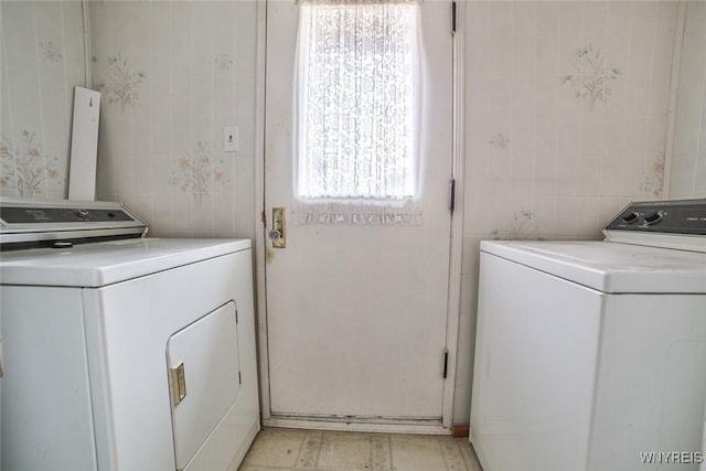 664 Upper Mountain Rd, Lewiston, NY 14092 - washroom featuring tile walls and washer and clothes dryer