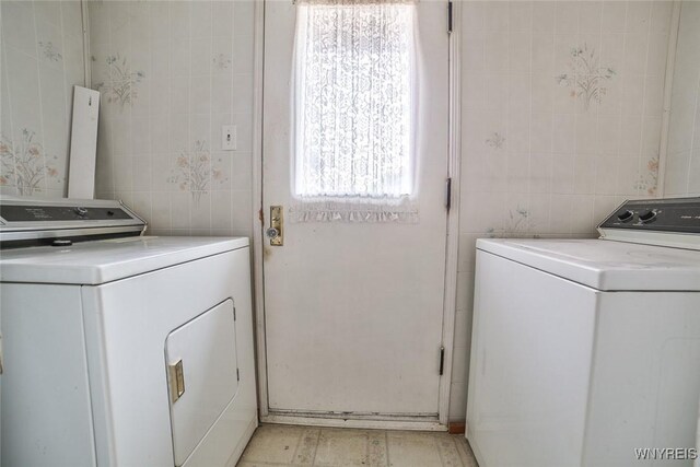 664 Upper Mountain Rd, Lewiston, NY 14092 - washroom featuring tile walls and washer and dryer