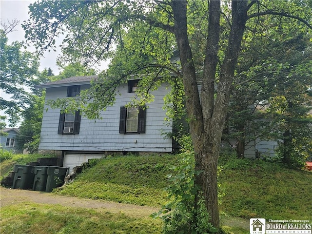 315 E 6th St, Jamestown, NY 14701 - view of side of home featuring a garage