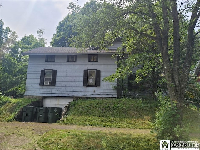 315 E 6th St, Jamestown, NY 14701 - view of front of house featuring an attached garage and driveway