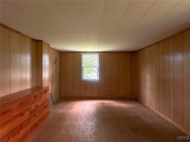 9067 Main St, Brookfield, NY 13418 - spare room with wooden walls and ornamental molding