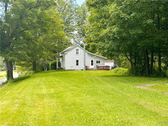 9067 Main St, Brookfield, NY 13418 - view of green lawn featuring a deck