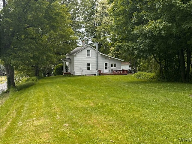 9067 Main St, Brookfield, NY 13418 - view of grassy yard with a wooden deck