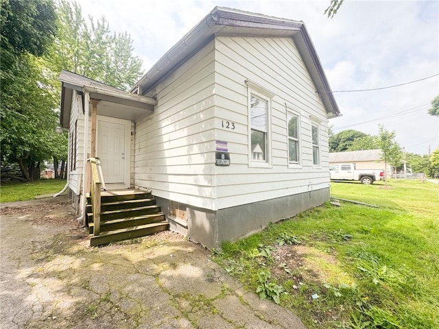123 Rauber St, Rochester, NY 14605 - view of side of property with a lawn