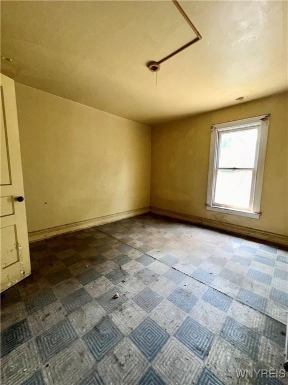 628 Elmwood Ave, Niagara Falls, NY 14301 - unfurnished room featuring tile patterned floors and baseboards