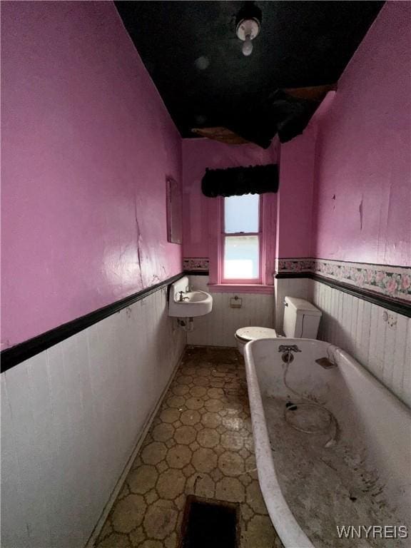 628 Elmwood Ave, Niagara Falls, NY 14301 - full bath with wainscoting, a bath, and tile patterned floors